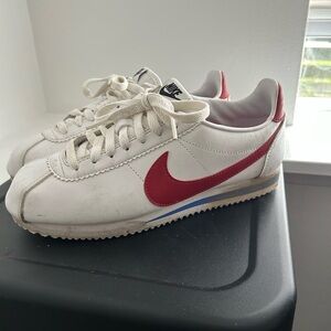 Nike White Sneakers with Red Swoosh and Blue Accent